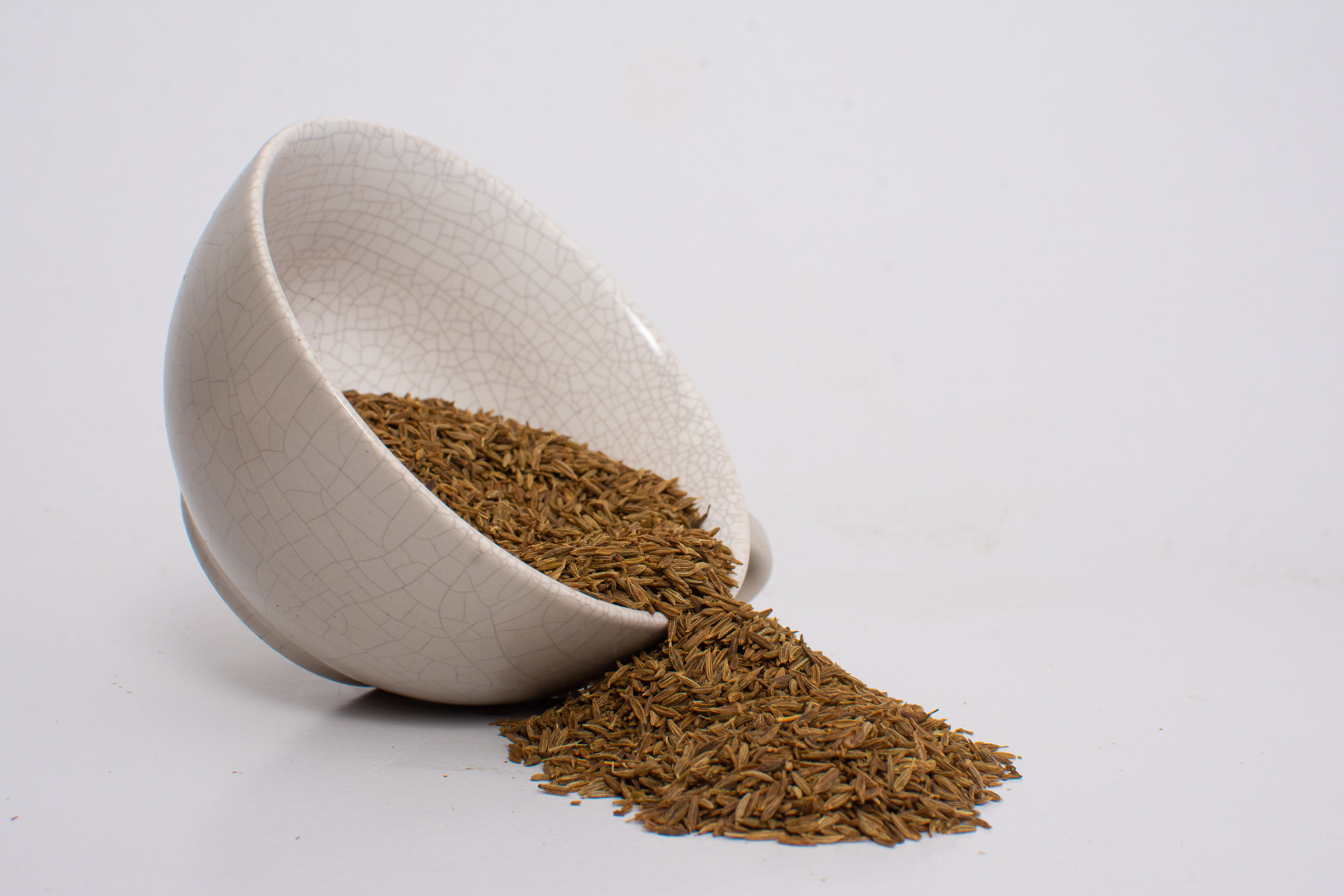 Whole spices in a ceramic bowl